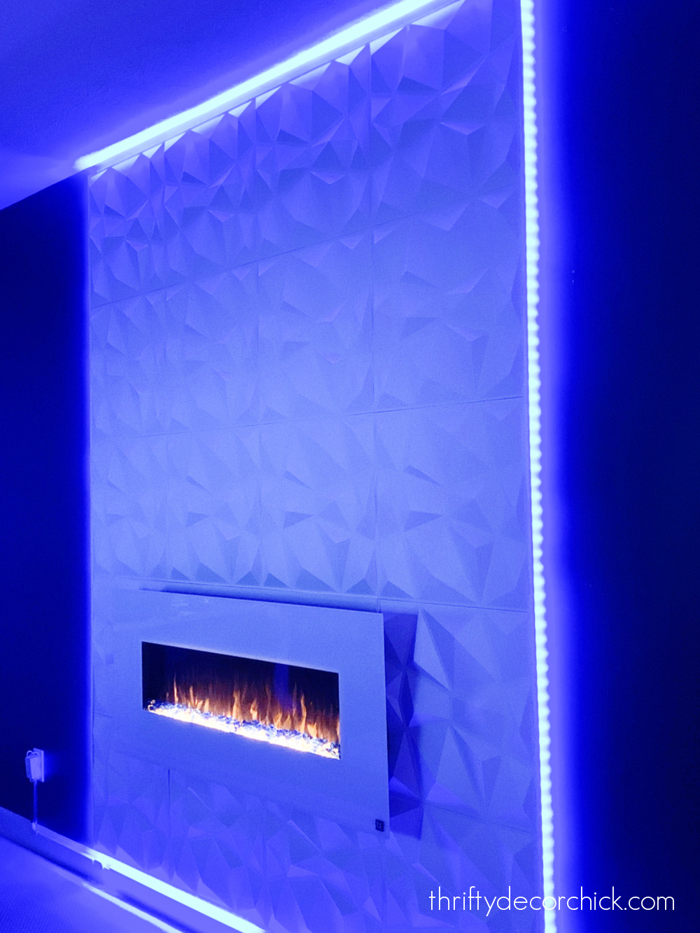 white modern fireplace with LED lights