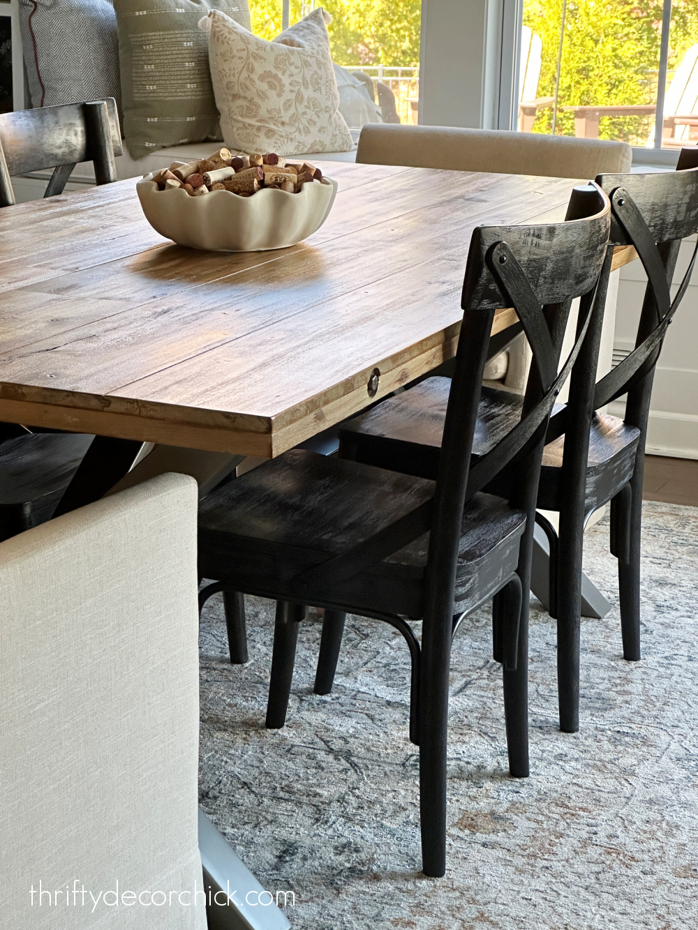 wood table black dining chairs