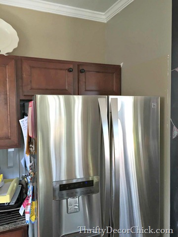 short cabinet above refrigerator