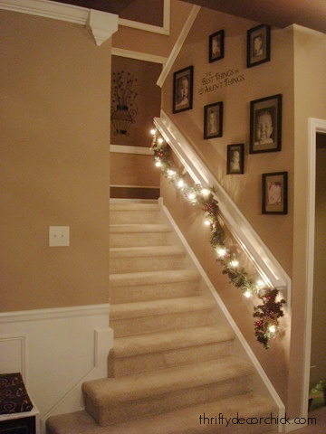 carpeted stairs gallery wall