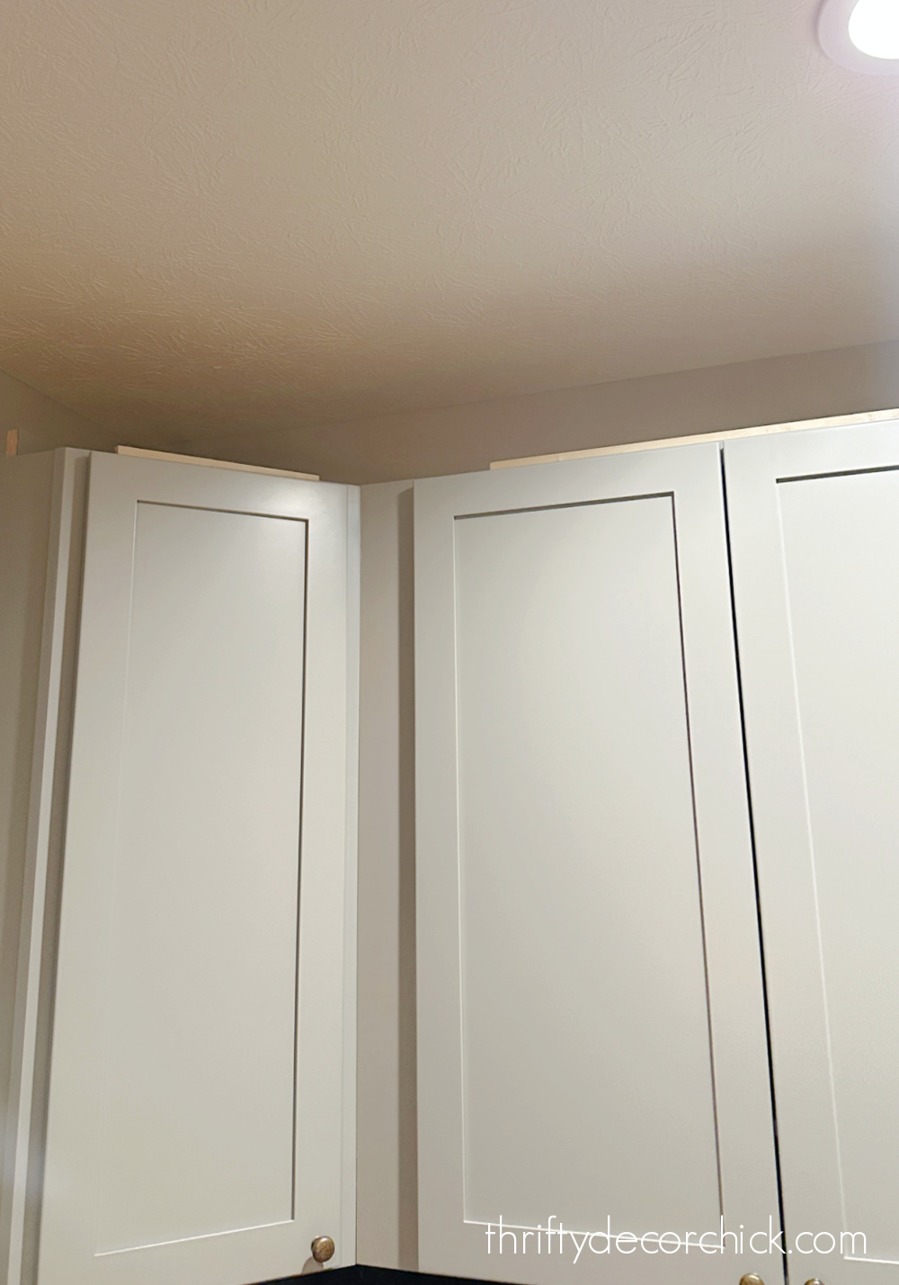 filling in small space above cabinets