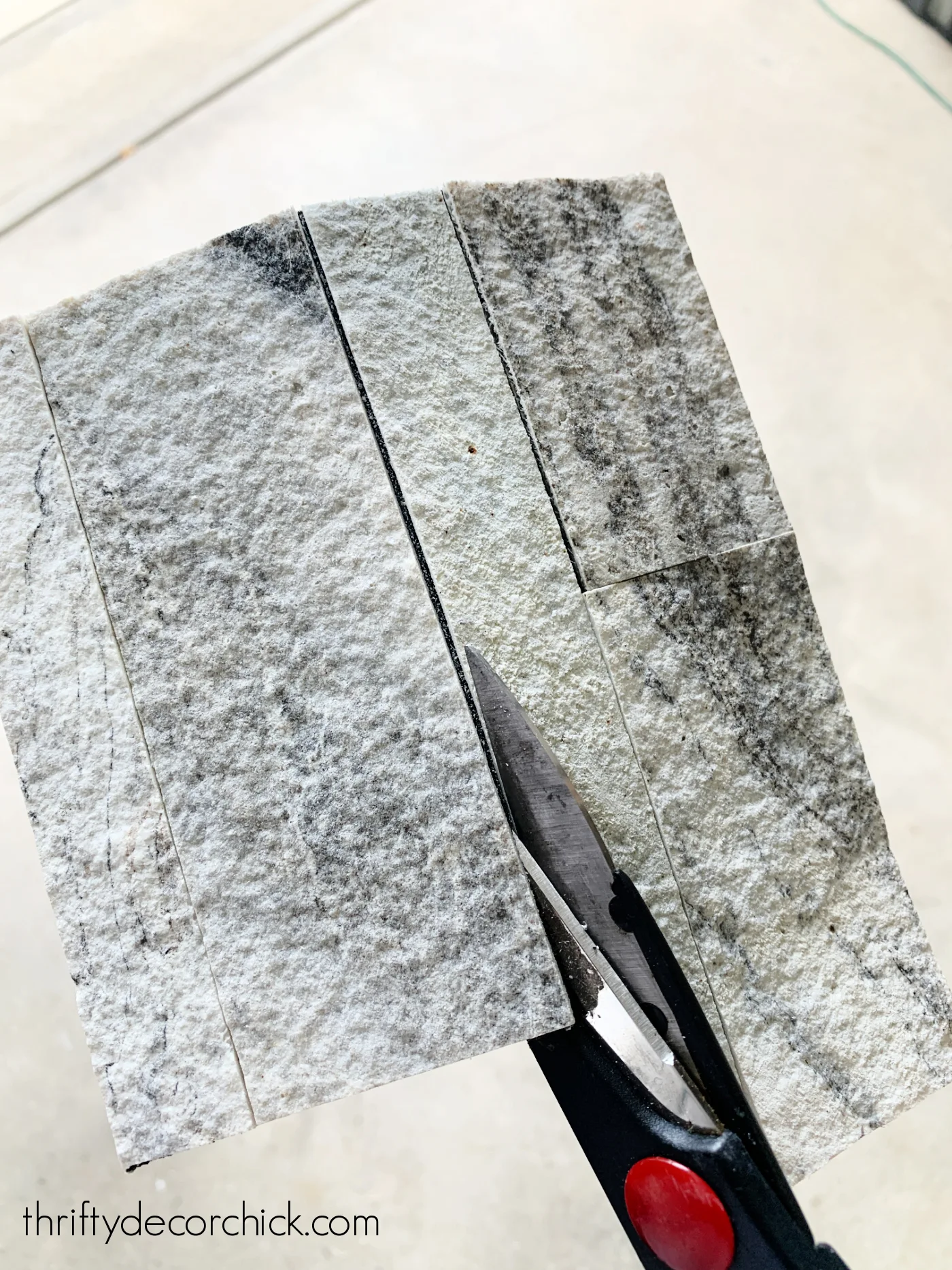 cutting stone peel and stick tile